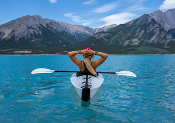 Woman_Kayaking_Mountain_Lake